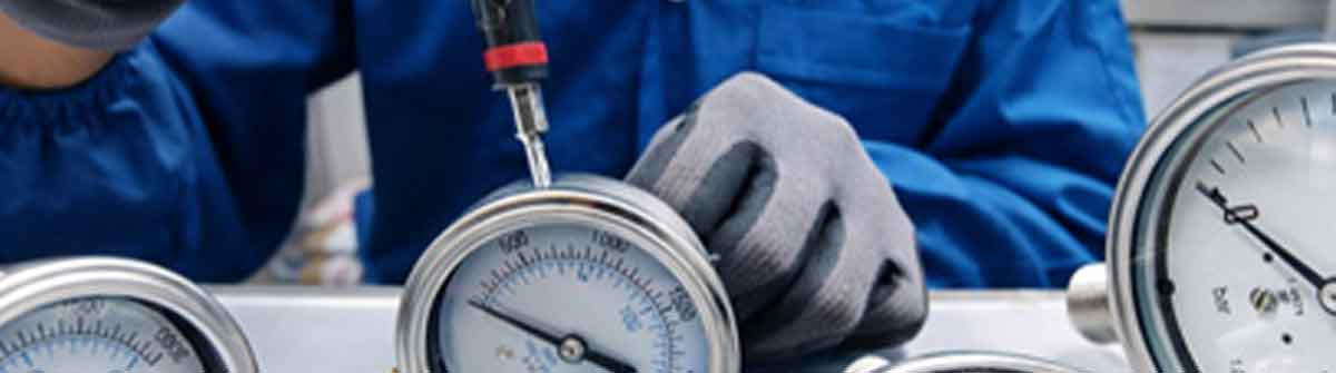 Technician repairing and remanufacturing industrial instrumentation